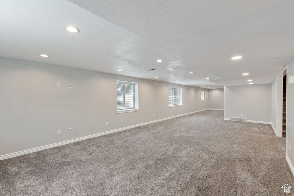 Basement featuring recessed lighting, carpet flooring, and baseboards