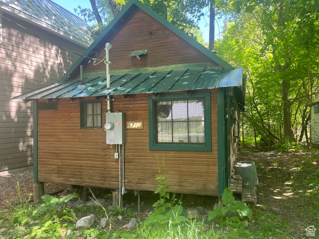 View of side of property with metal roof