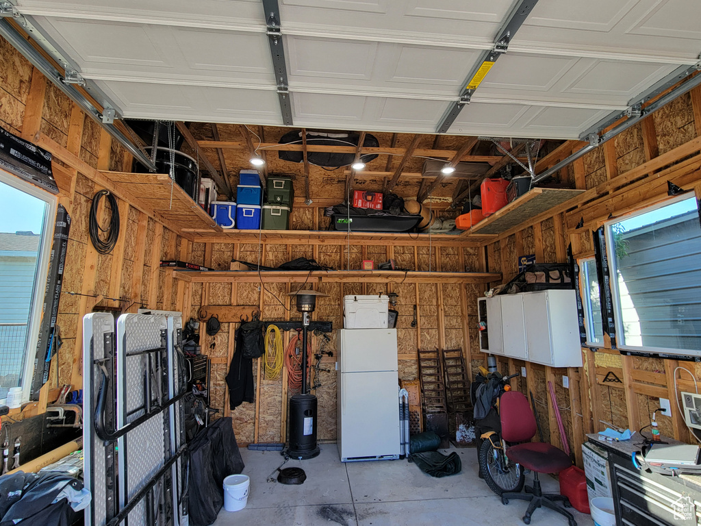 Garage with freestanding refrigerator