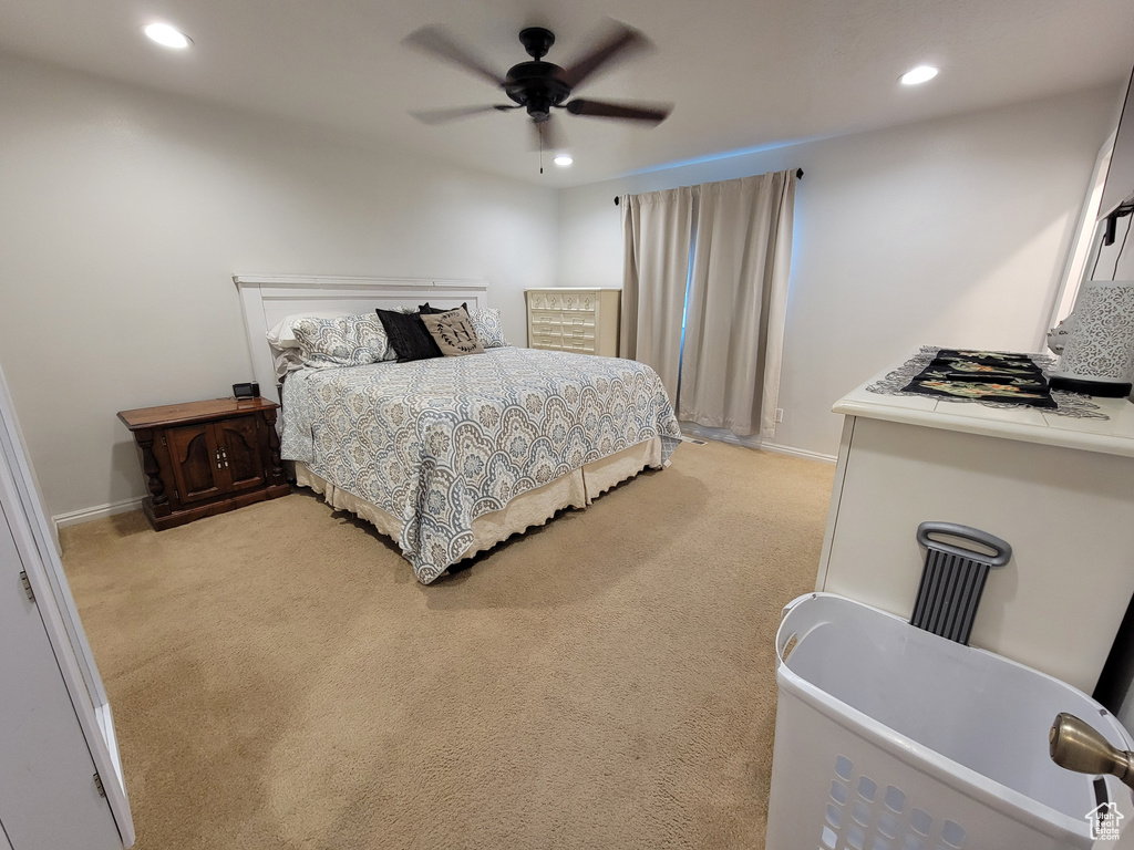 Bedroom featuring light colored carpet, recessed lighting, a ceiling fan, and baseboards