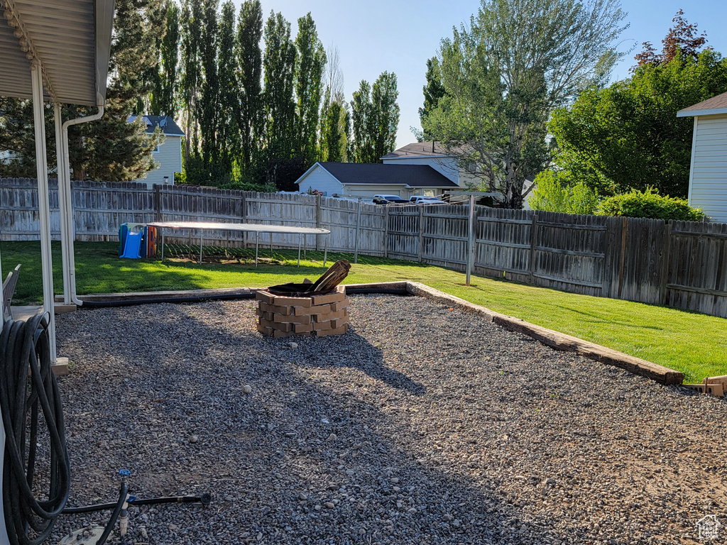 View of yard with a fire pit
