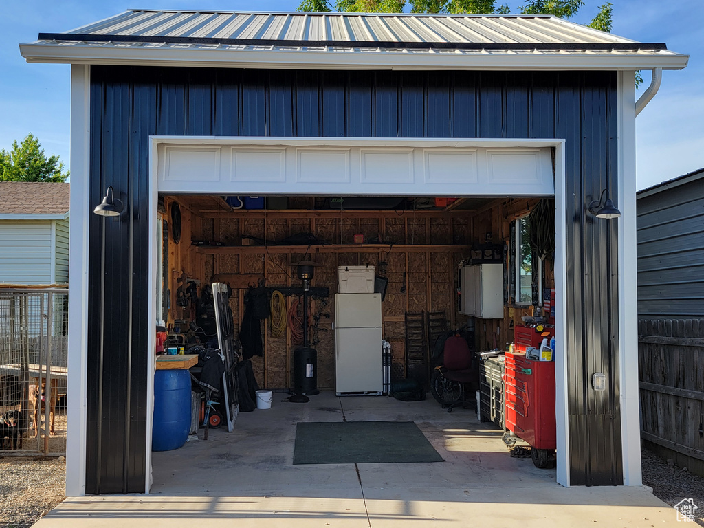 Detached garage featuring refrigerator