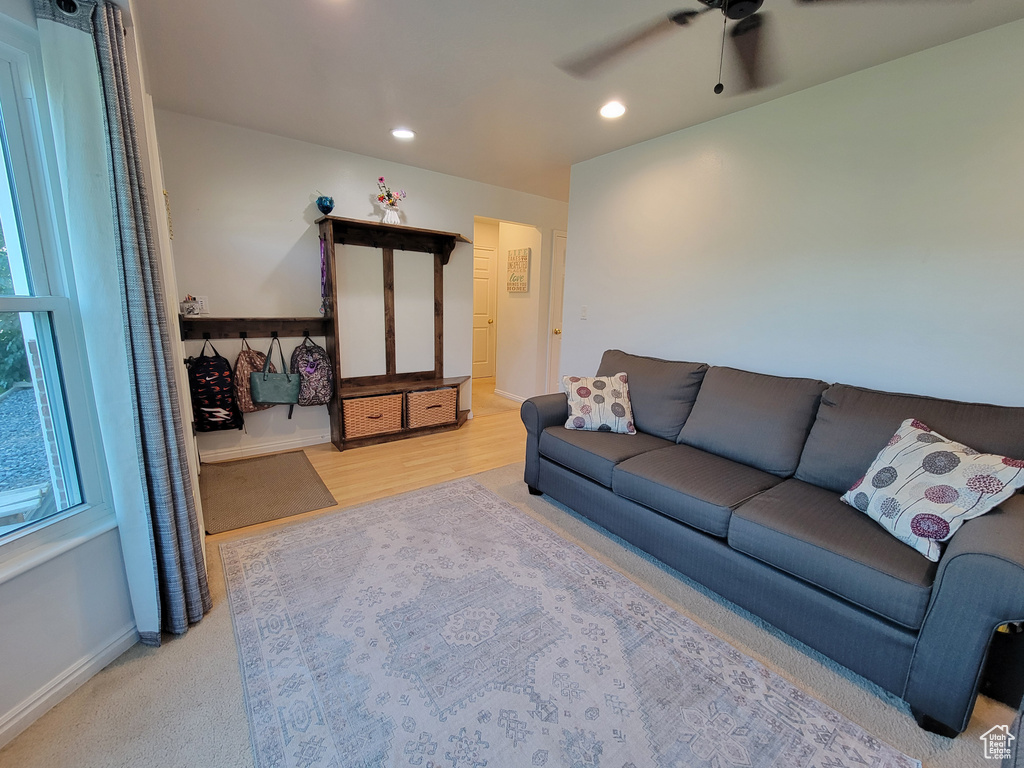 Living area featuring a ceiling fan, recessed lighting, and baseboards