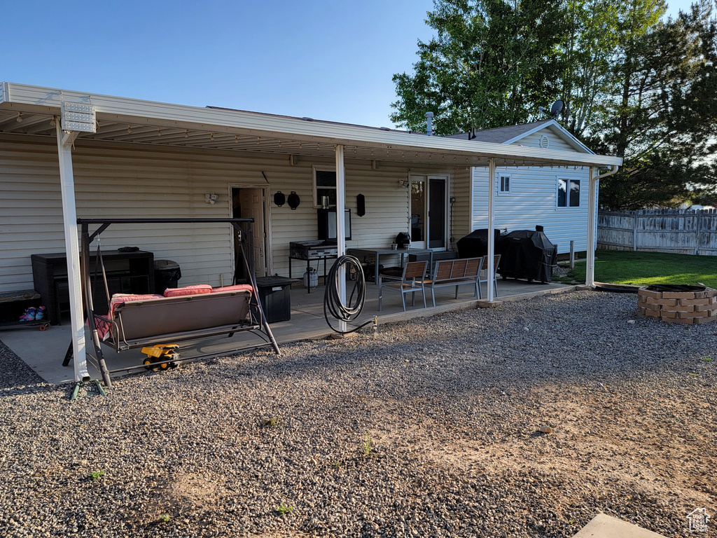 Rear view of property with a patio area