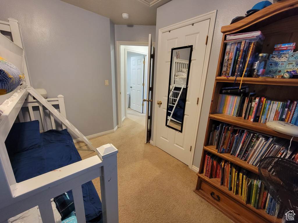 Carpeted bedroom with baseboards