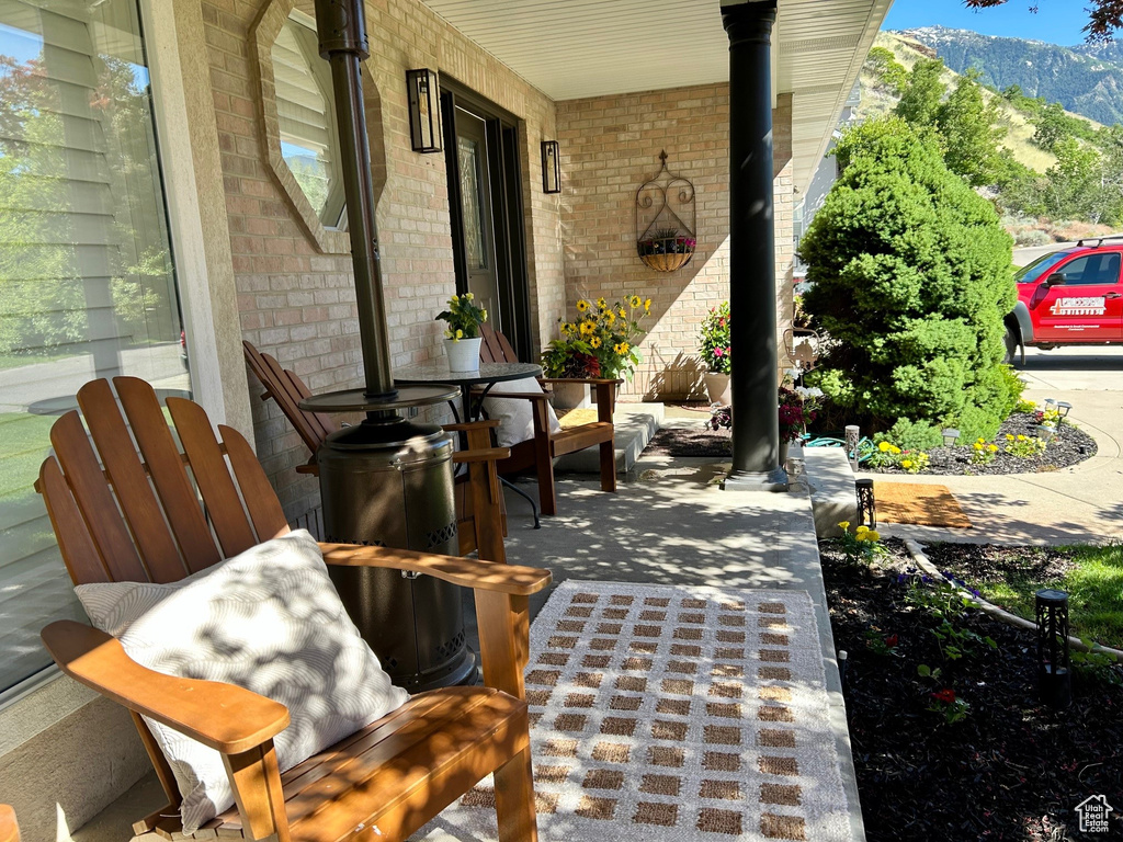 Covered porch with a mountain view