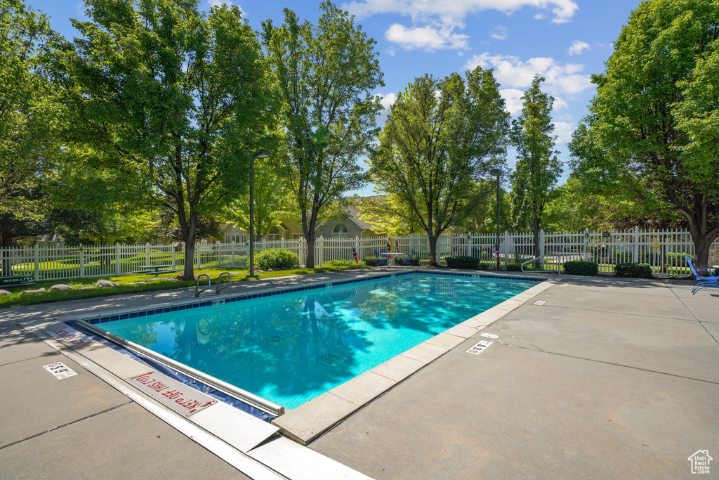 Community pool with a patio area