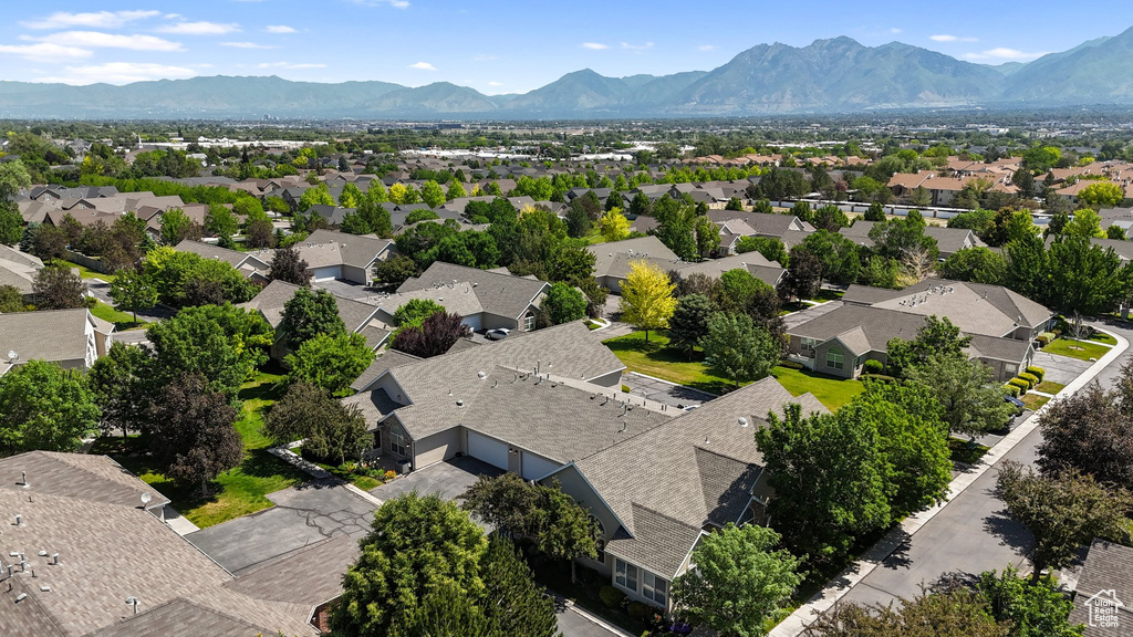 Aerial perspective of suburban area featuring a mountain backdrop