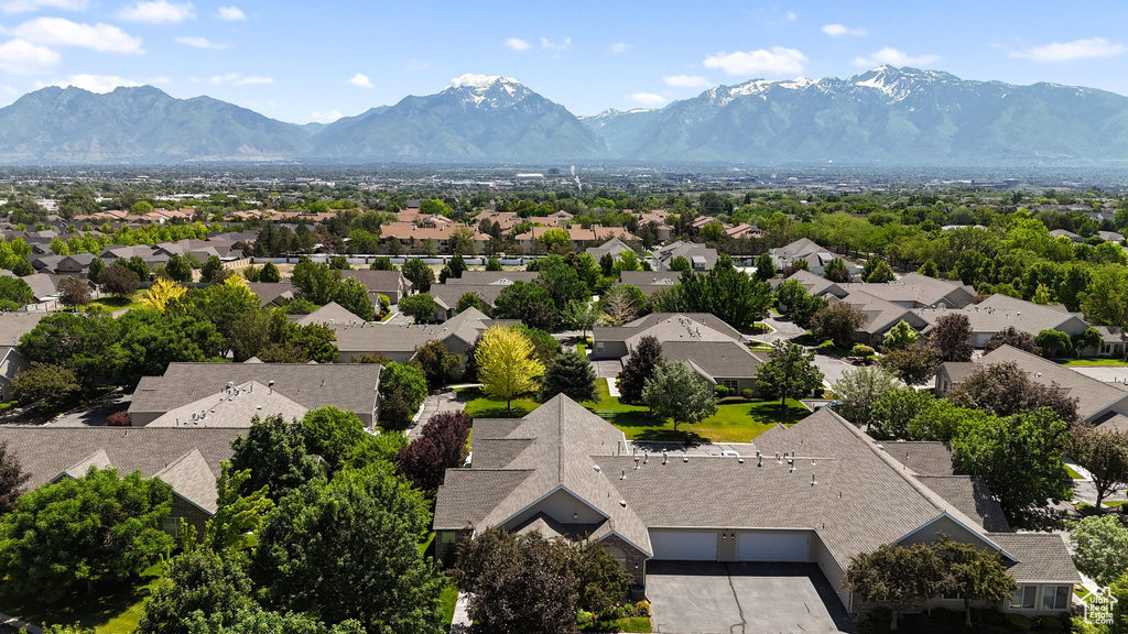 Aerial perspective of suburban area featuring a mountain backdrop