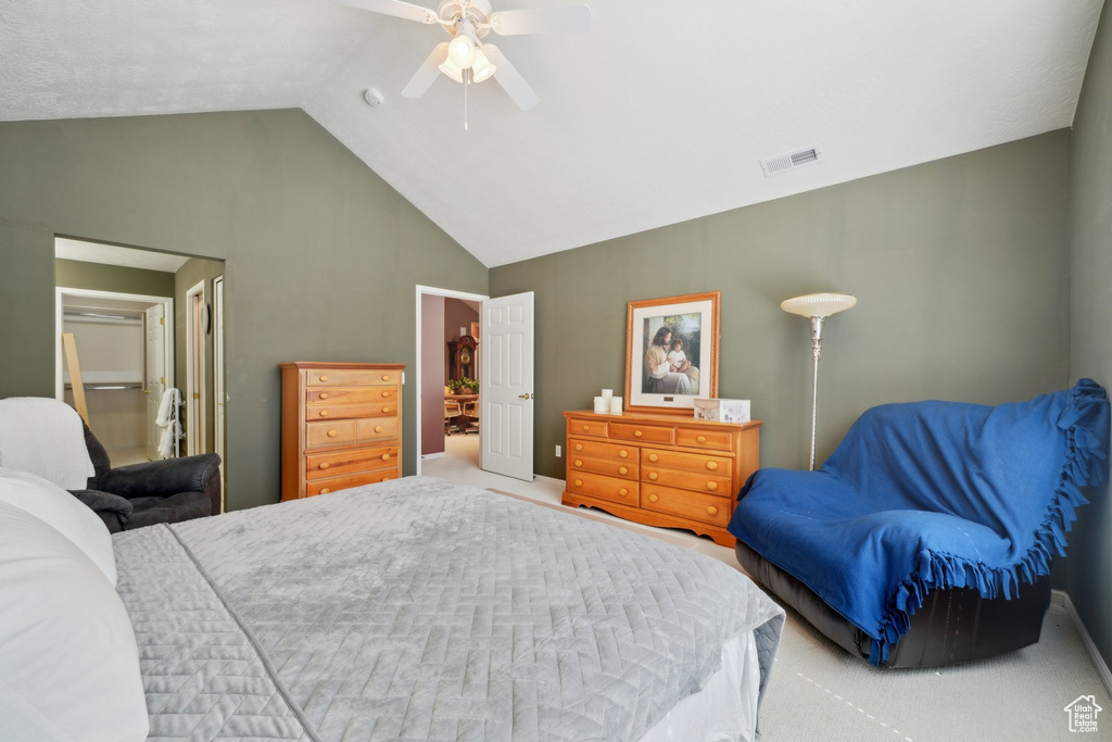 Bedroom featuring carpet floors, ceiling fan, and high vaulted ceiling