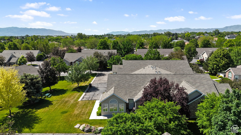 Aerial view of residential area featuring mountains
