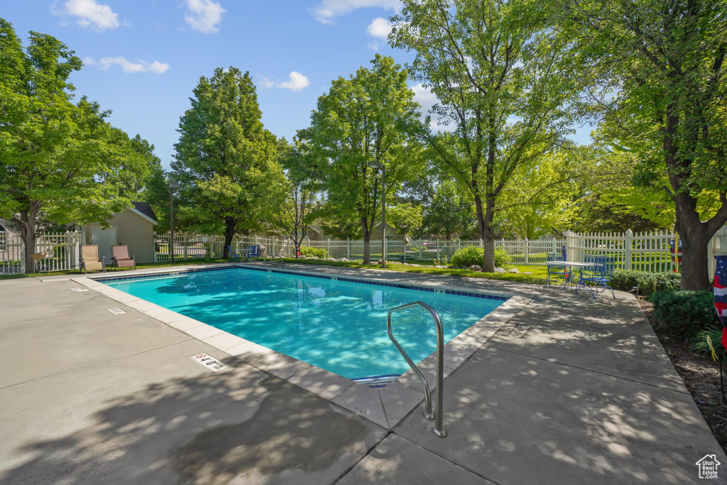 Community pool featuring a patio area