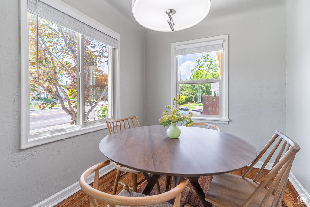 Dining area featuring baseboards and wood finished floors