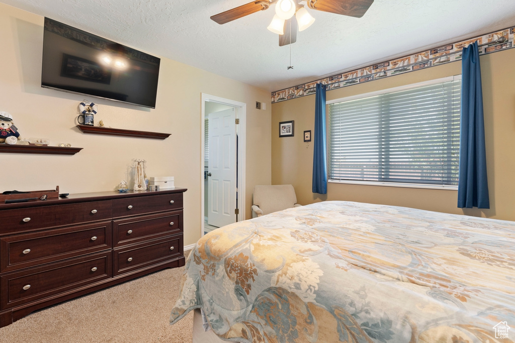 Bedroom with carpet and ceiling fan