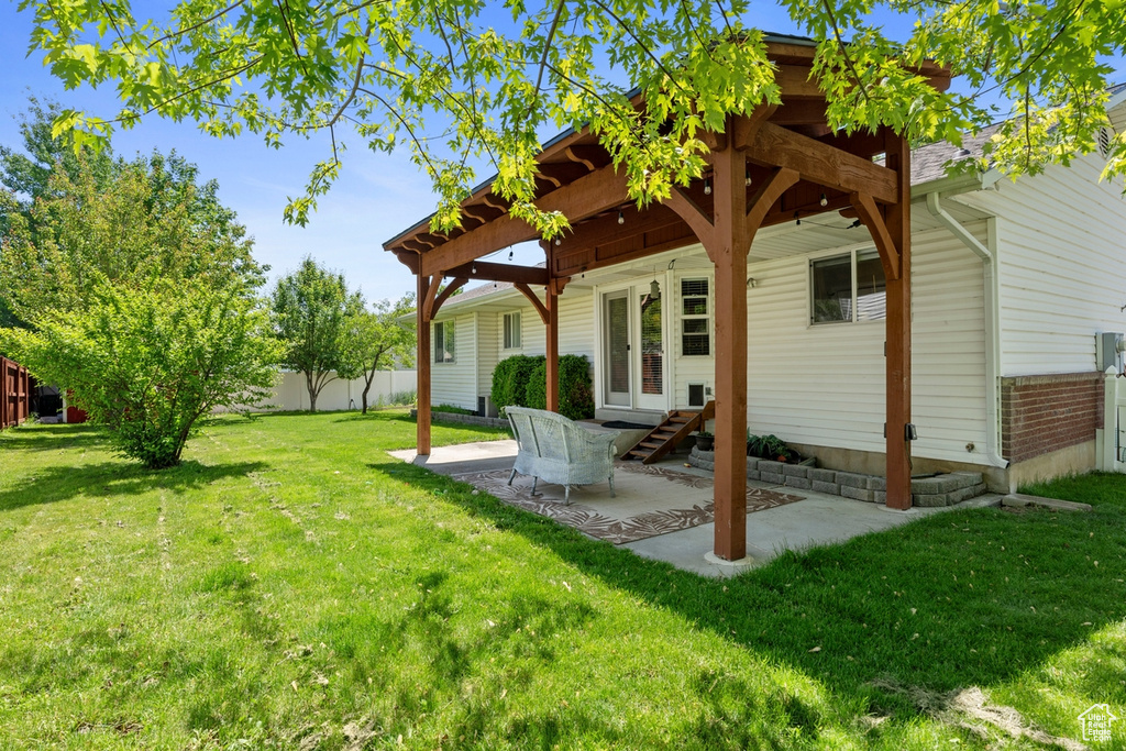 Rear view of house featuring a patio area
