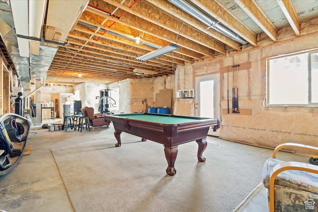 Game room with billiards and concrete floors