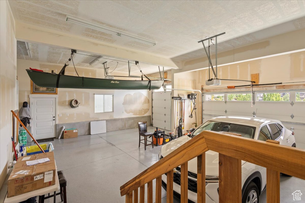 Garage featuring a garage door opener