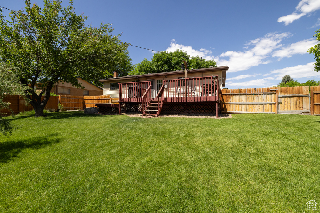 Back of house featuring a deck