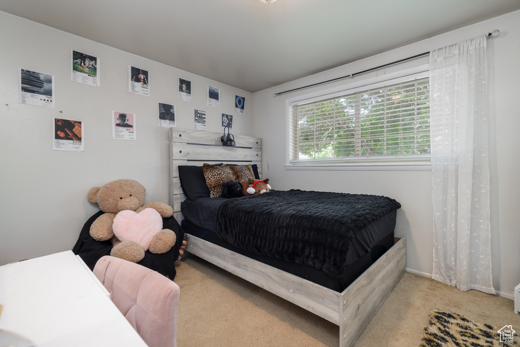 Bedroom with carpet and baseboards