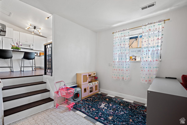 Game room with baseboards