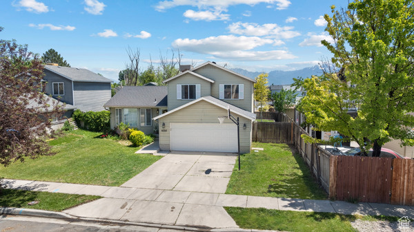 View of front of home featuring concrete driveway