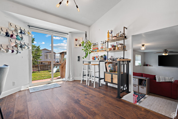 Interior space featuring wood finished floors, ceiling fan, and baseboards
