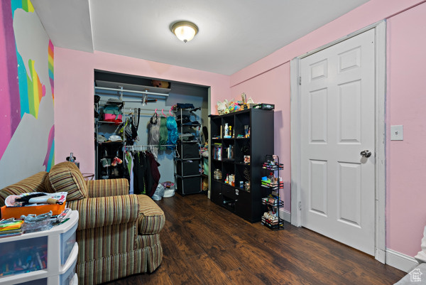 Sitting room featuring wood finished floors and baseboards
