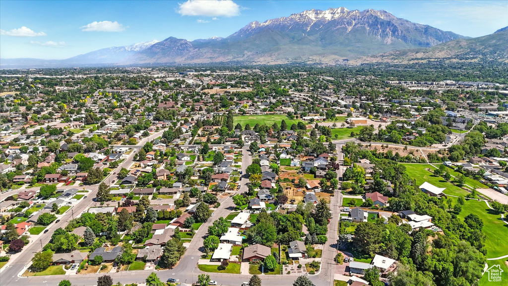Aerial perspective of suburban area featuring a mountainous background