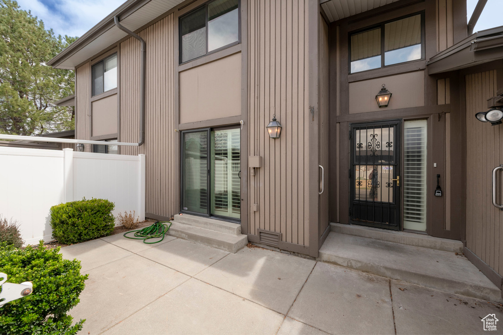 Property entrance with a patio