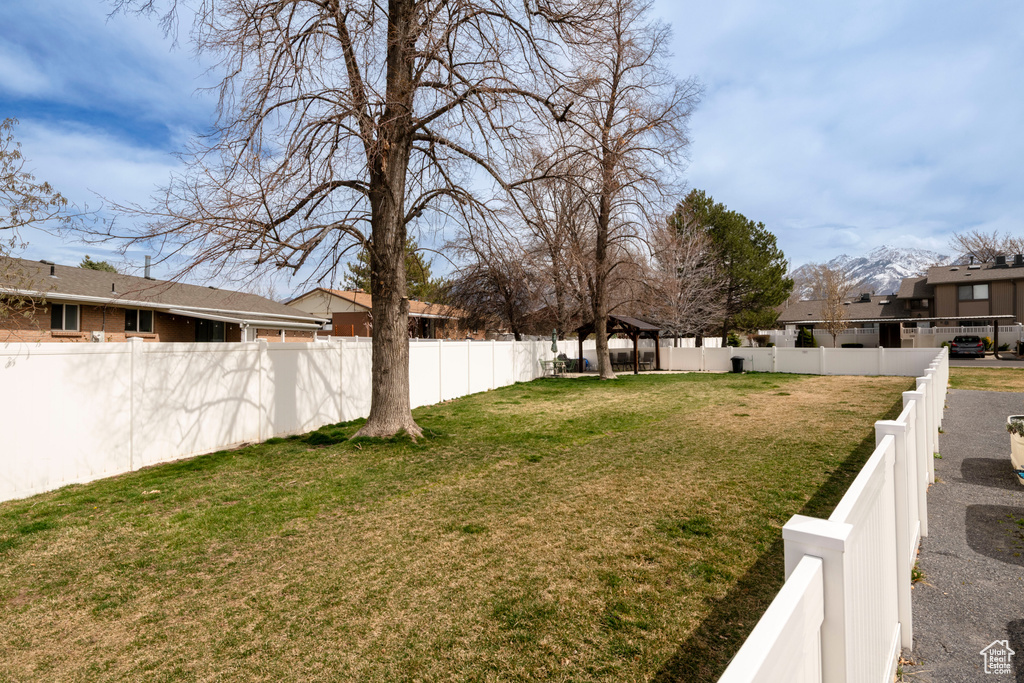 View of yard featuring a gazebo and a residential view