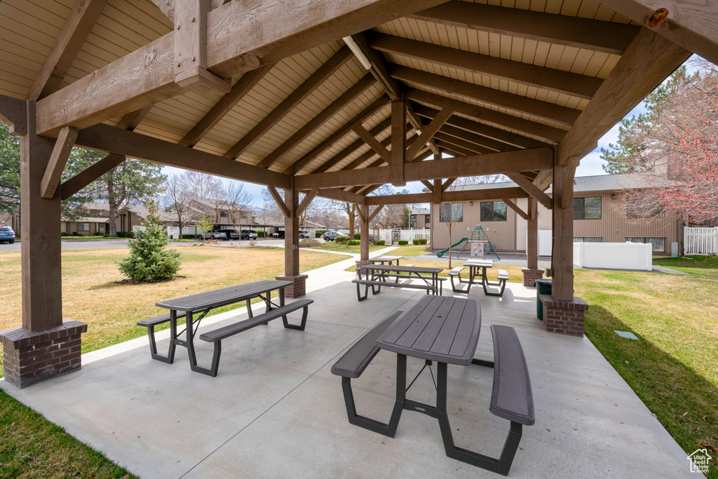 Surrounding community with a gazebo, a patio area, and a residential view