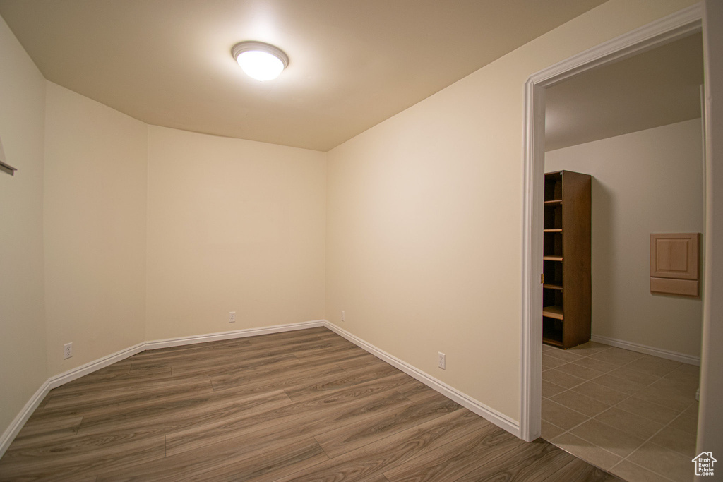Empty room featuring wood finished floors and baseboards
