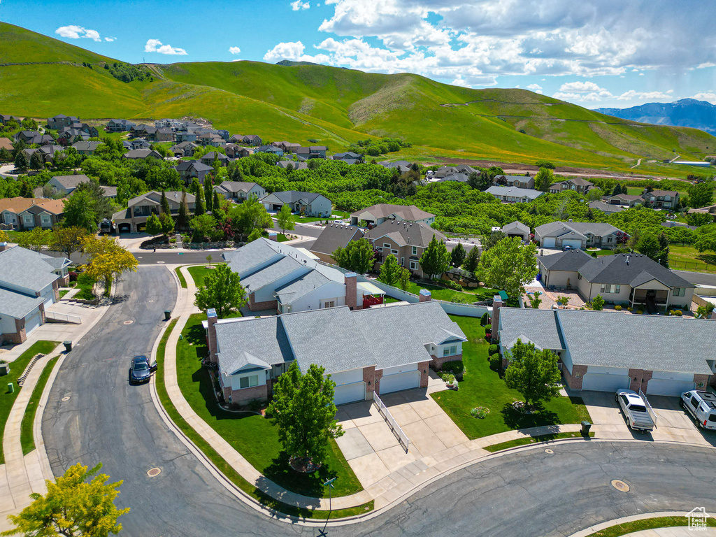 Aerial view of residential area featuring mountains