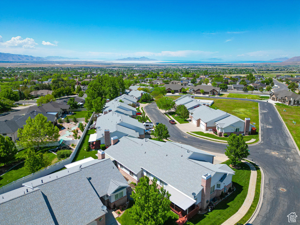 Aerial perspective of suburban area featuring a mountain backdrop