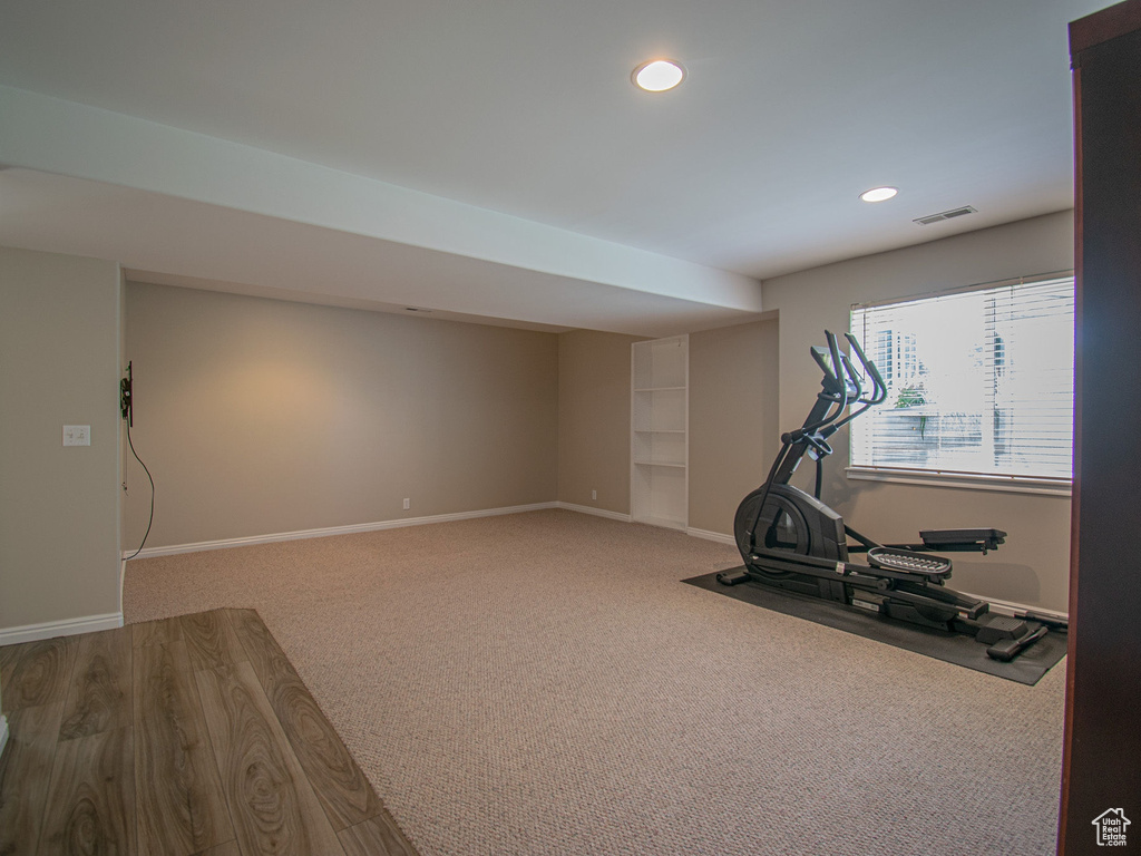 Workout room with recessed lighting, baseboards, built in features, and carpet floors