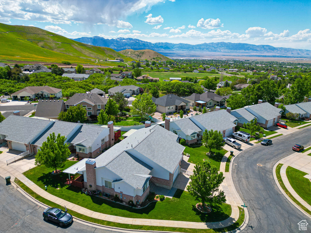 Aerial view of residential area featuring mountains
