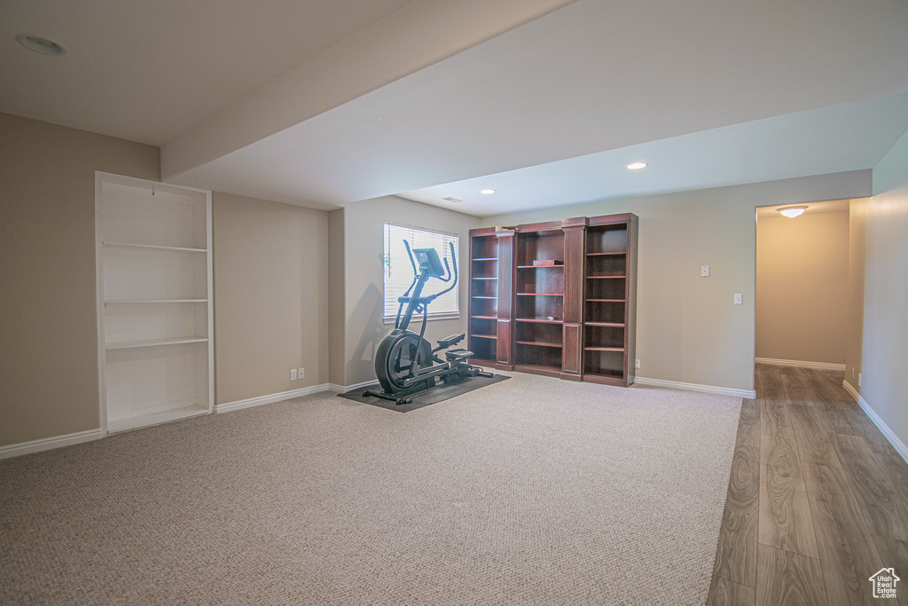 Workout area featuring baseboards, recessed lighting, and wood finished floors
