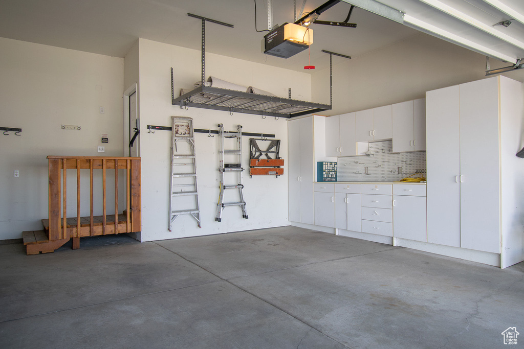 Garage featuring a garage door opener