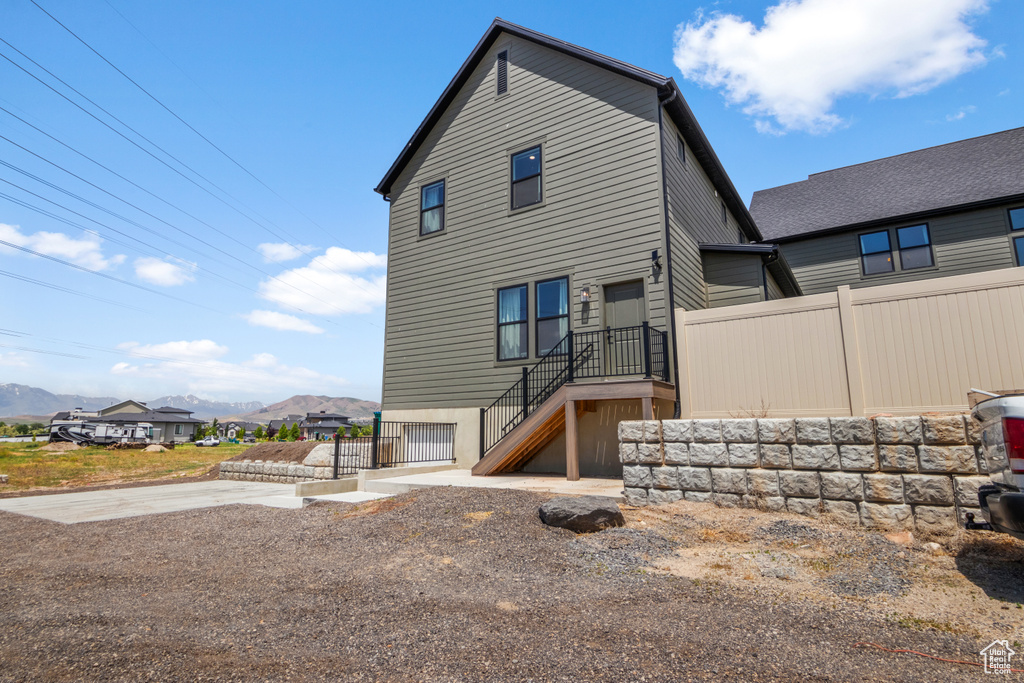 Back of house featuring a mountain view