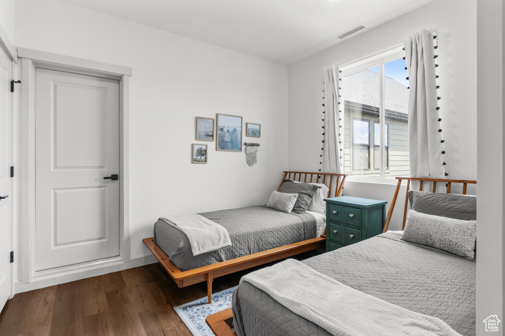 Bedroom with wood finished floors