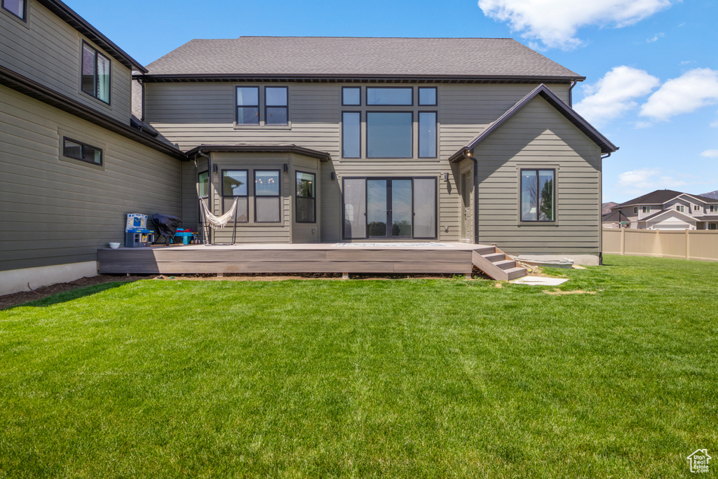 Rear view of property with a deck