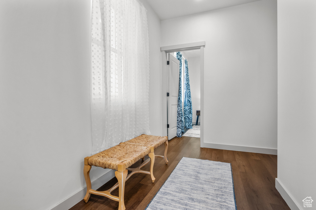 Interior space with baseboards and wood finished floors