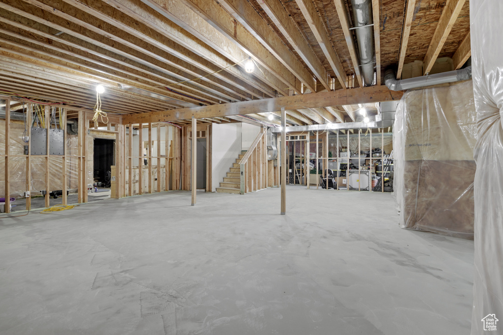 Unfinished basement featuring stairway