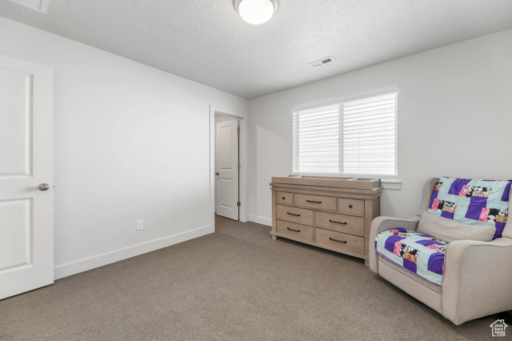Bedroom with carpet floors and baseboards