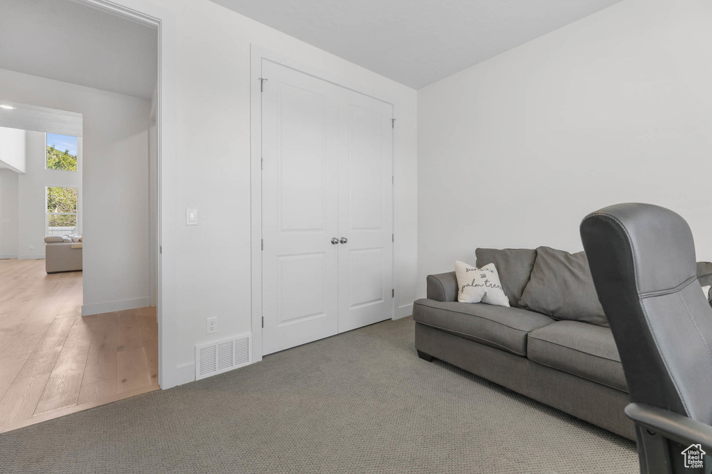 Carpeted living room with baseboards