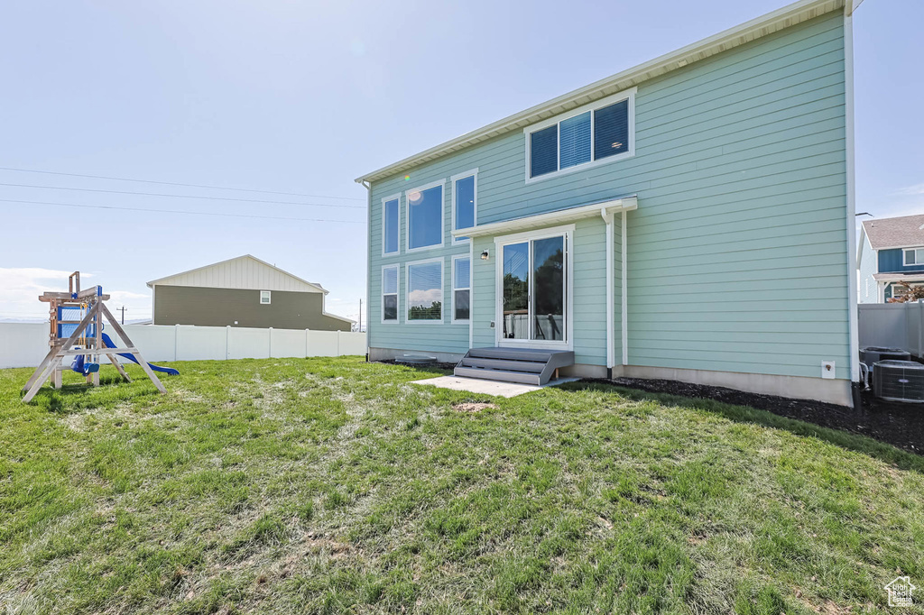 Back of property featuring central AC unit