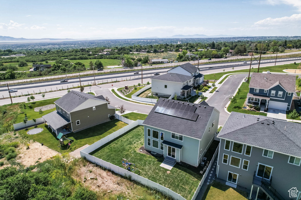 Aerial perspective of suburban area with a mountain backdrop