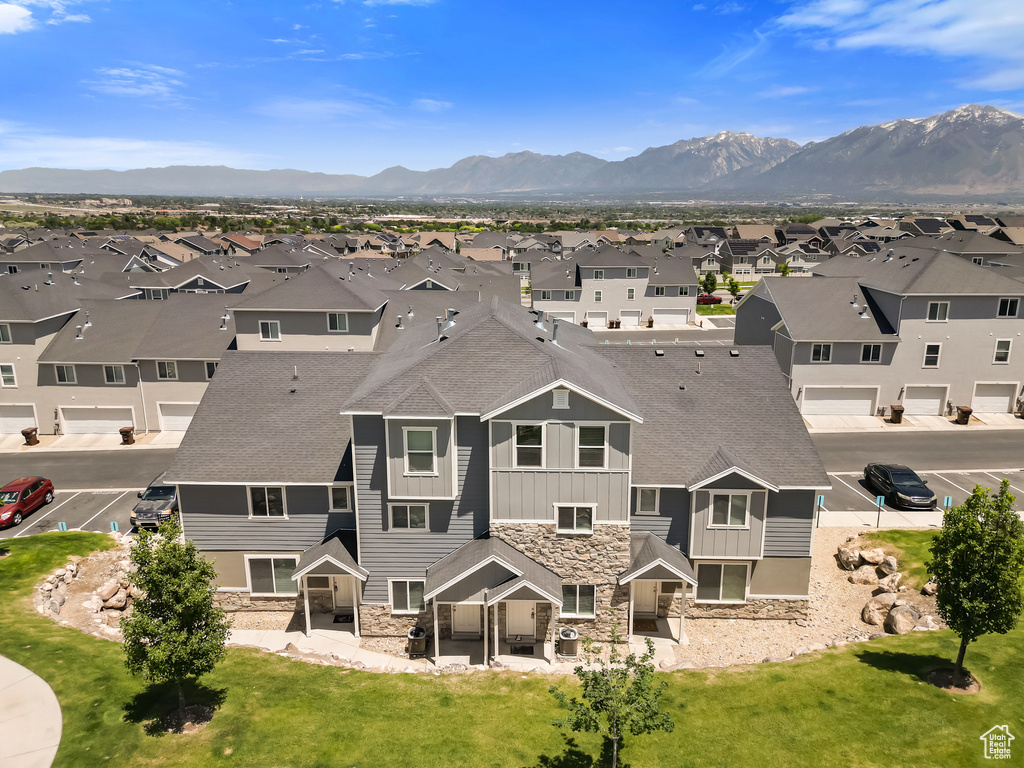 Aerial view of residential area with a mountainous background