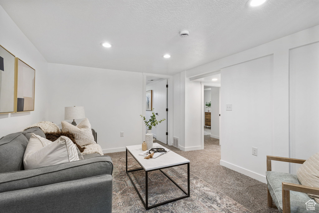 Living room featuring recessed lighting and carpet floors