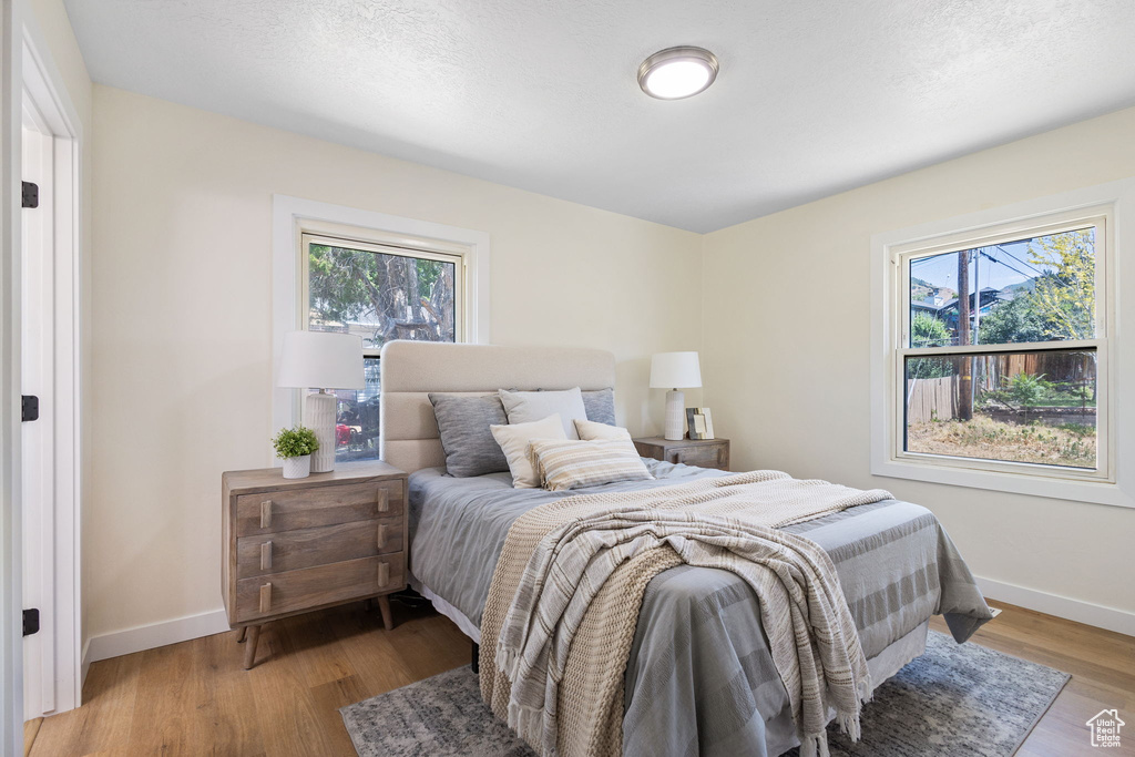 Bedroom with baseboards and light wood-style flooring